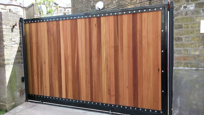 Steel framed wooden driveway gate installed.