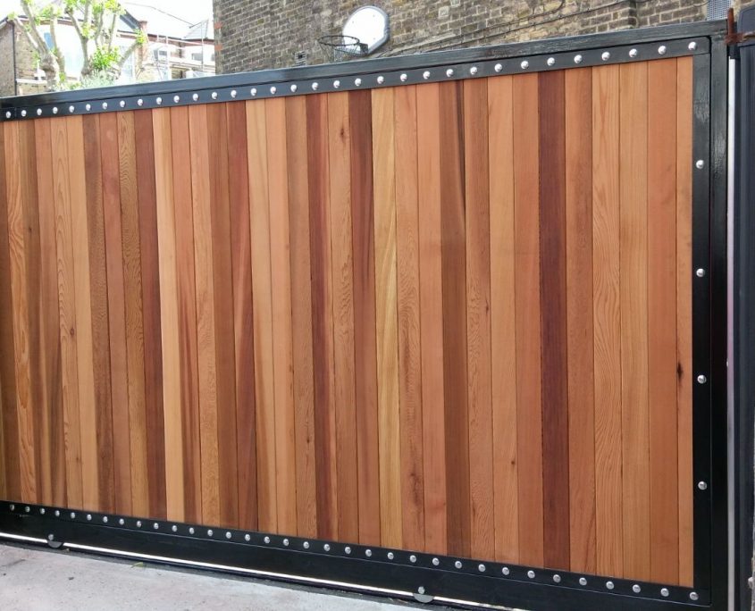 Steel framed wooden driveway gate installed.
