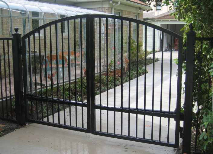 Curved top iron swing gates