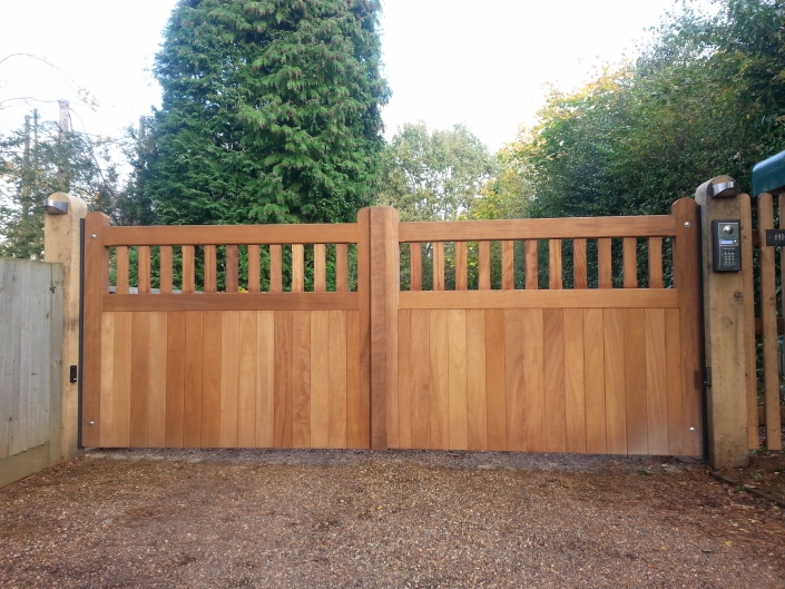 Wooden gates with part open boarded design